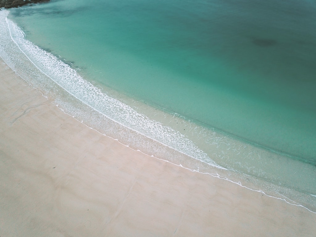 dji mavic pro aerial shot of gimsoya beach clear waters in lofoten islands norway drone