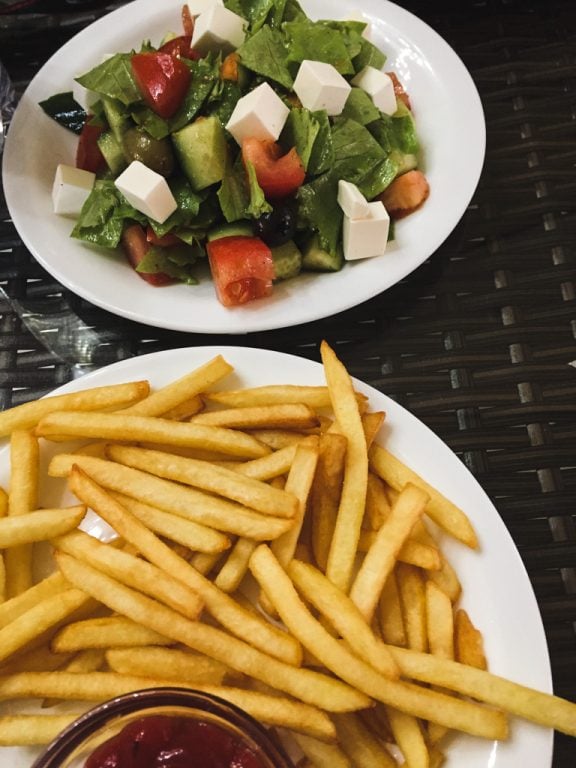 greek salad and fries in osh, kyrgyzstan