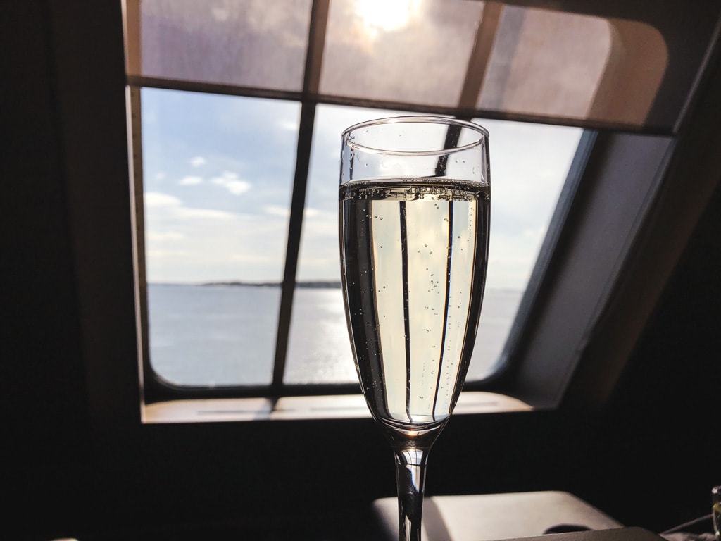 Tallinn to Helsinki Ferry: Cruising Across the Baltic Sea with Tallink Megastar champagne in business lounge with ocean view