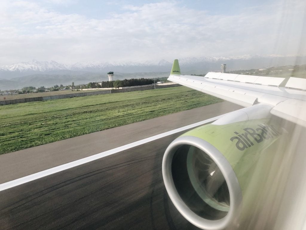 Arriving at Almaty Airport with airBaltic (and What to Do Once You Land) bombardier cs300 airbaltic inside of plane