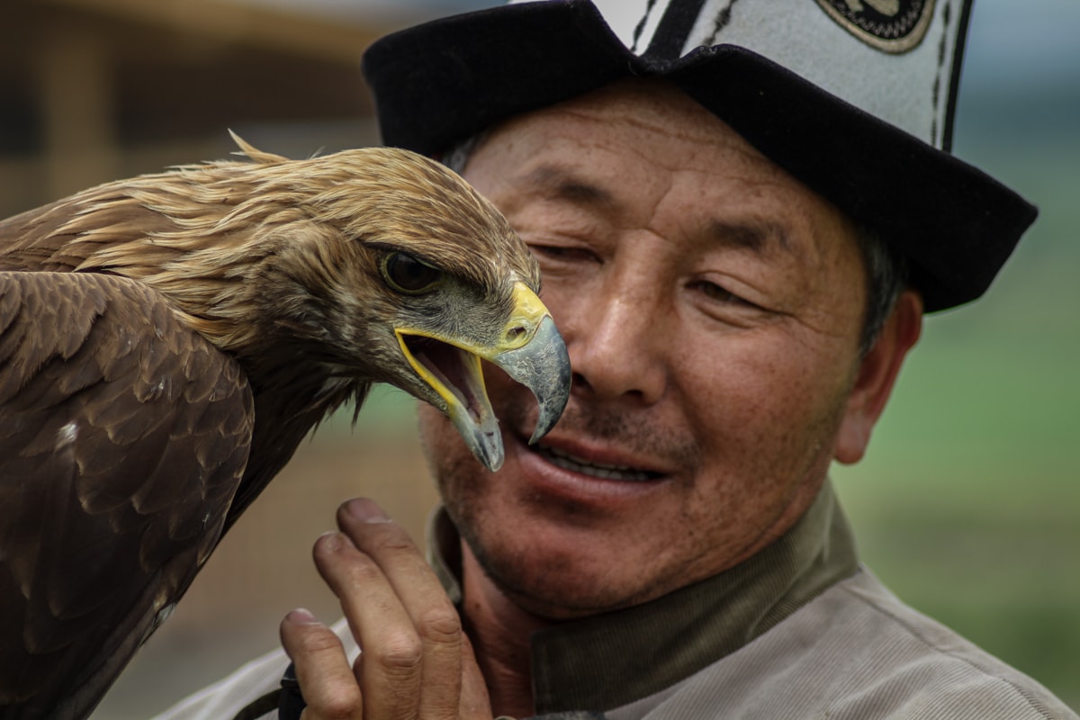 Central Asia Travel Tips: 50 Things to Know and Do Before You Visit eagle hunter in kyrgyzstan