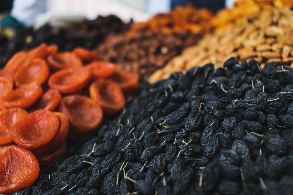 Central Asia Travel Tips: 50 Things to Know and Do Before You Visit mosque dried fruit at green bazaar in almaty, kazakhstan
