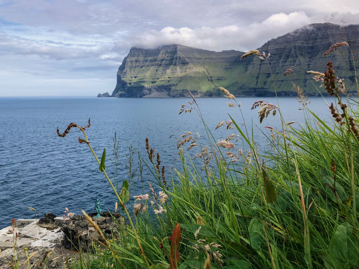 Mikladalur on Kalsoy Selkie Statue and view of Kunoy - Visit Faroe Islands: A Guide to the Best Views and Photography Spots