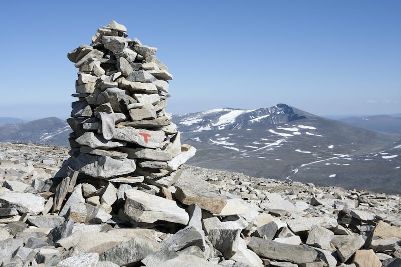 Cairn with red route T marking of the Norwegian Trekking Association (Glittertind mountain, Jotunheimen National park, Norway)