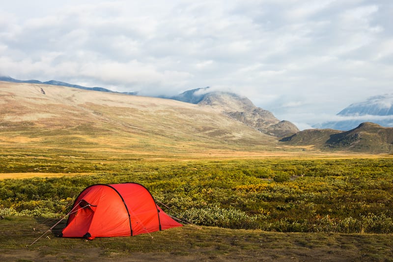 Camping in a red tent in beautiful Jotunheimen, Norway