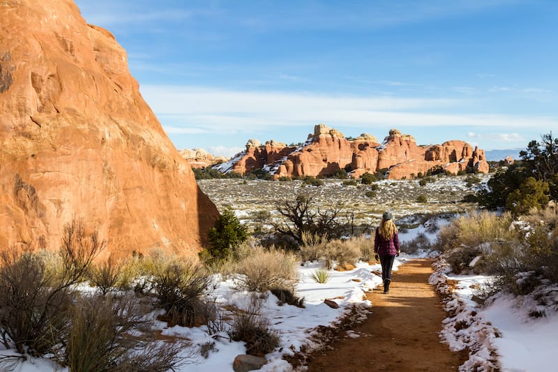 Female in Arches National Park in snow