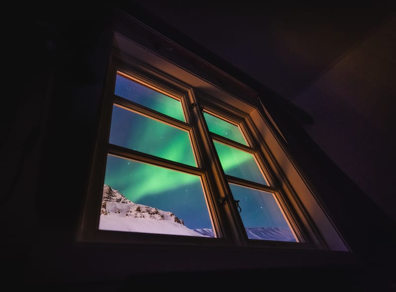 Northern lights in Svalbard window shutterstock_1262489242