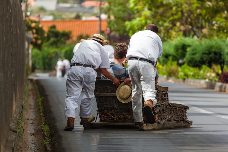 Toboggan riders on sledge in Monte - Funchal Madeira island