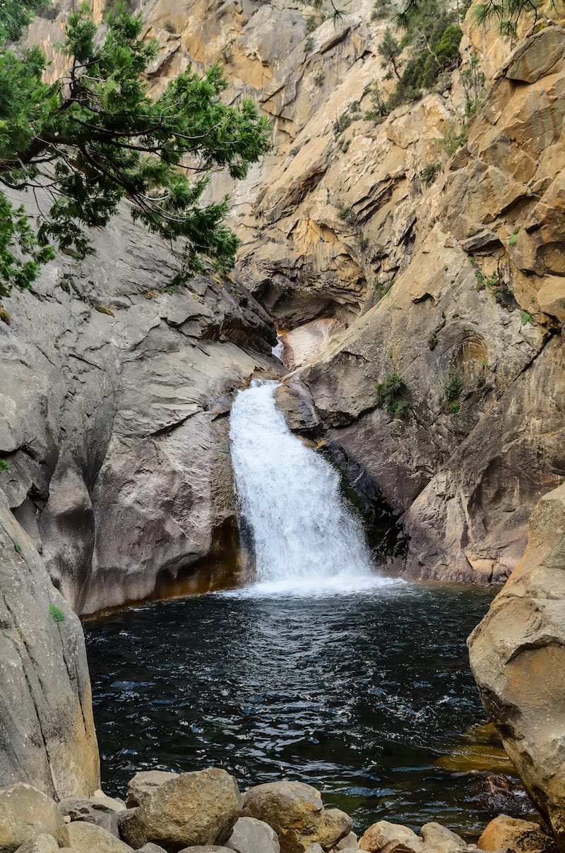 Roaring River Falls. Waterfall cascading over granite monoliths into a rock pool. Sequoia National Forest