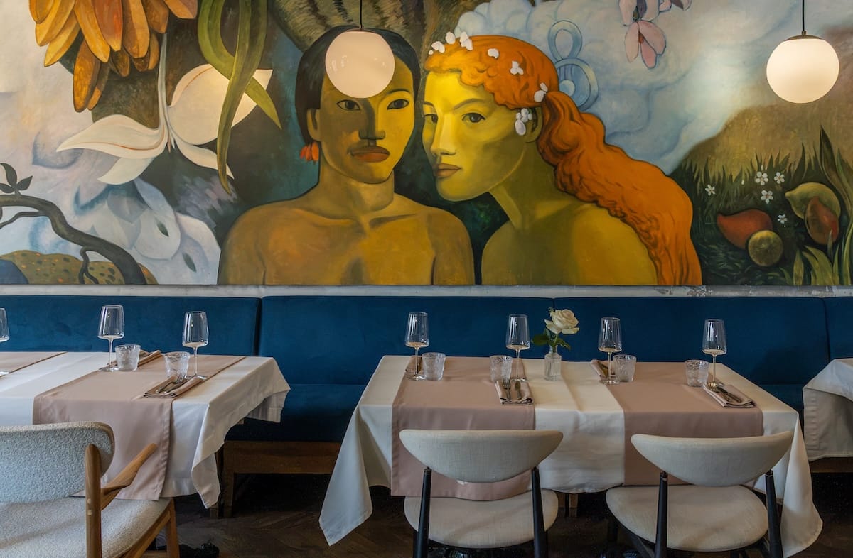 a fancy restauant with a mural on the wall
best restaurants in almaty, kazakhstan