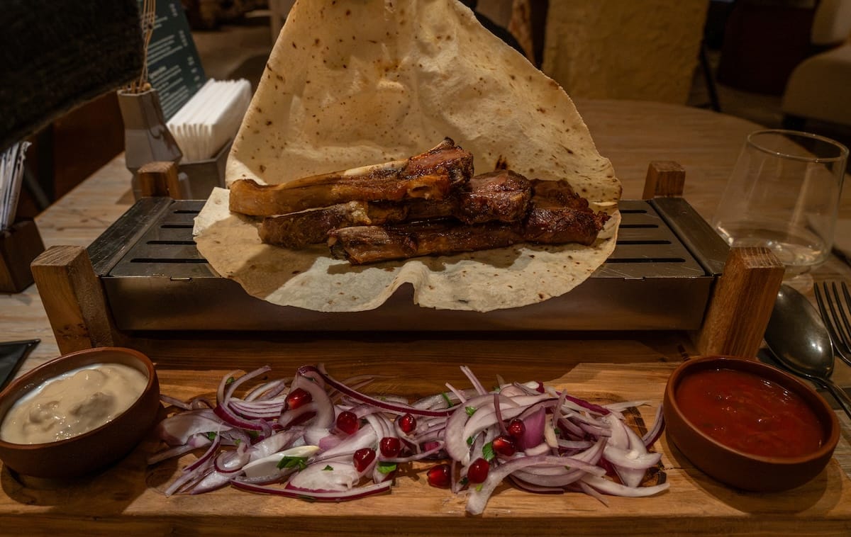 bbq meat and onions presented nicely at a restaurant
best restaurants in almaty, kazakhstan