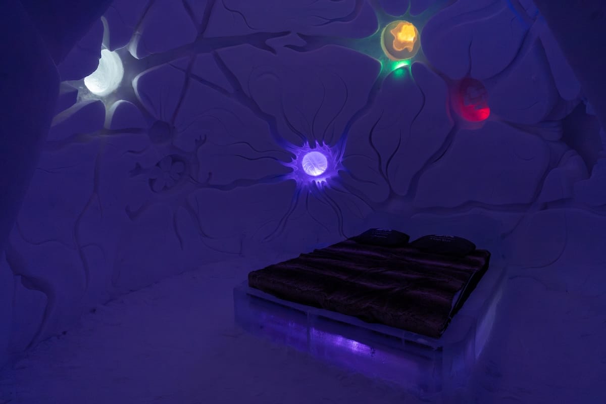 the inside of a snow and ice hotel in lapland