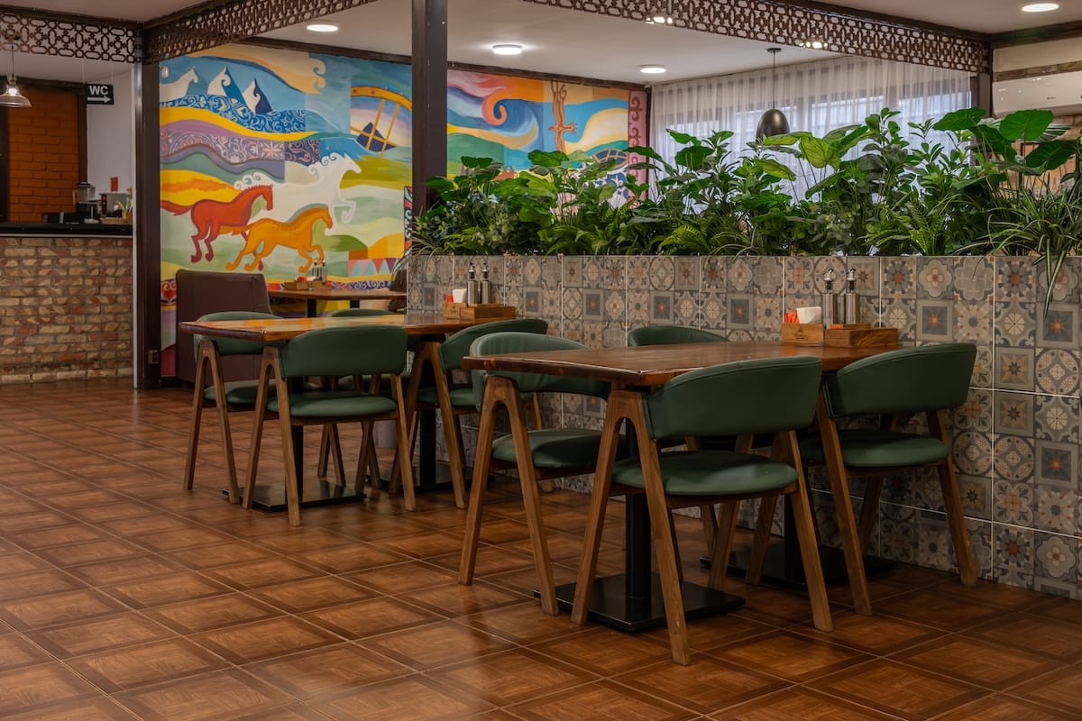 the inside of a restaurant with tables and chairs
best restaurants in almaty, kazakhstan