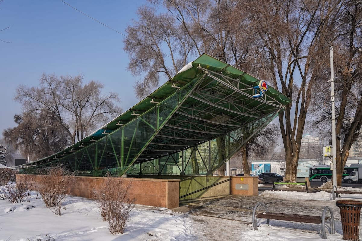 a metro station entrance in the snow in almaty
