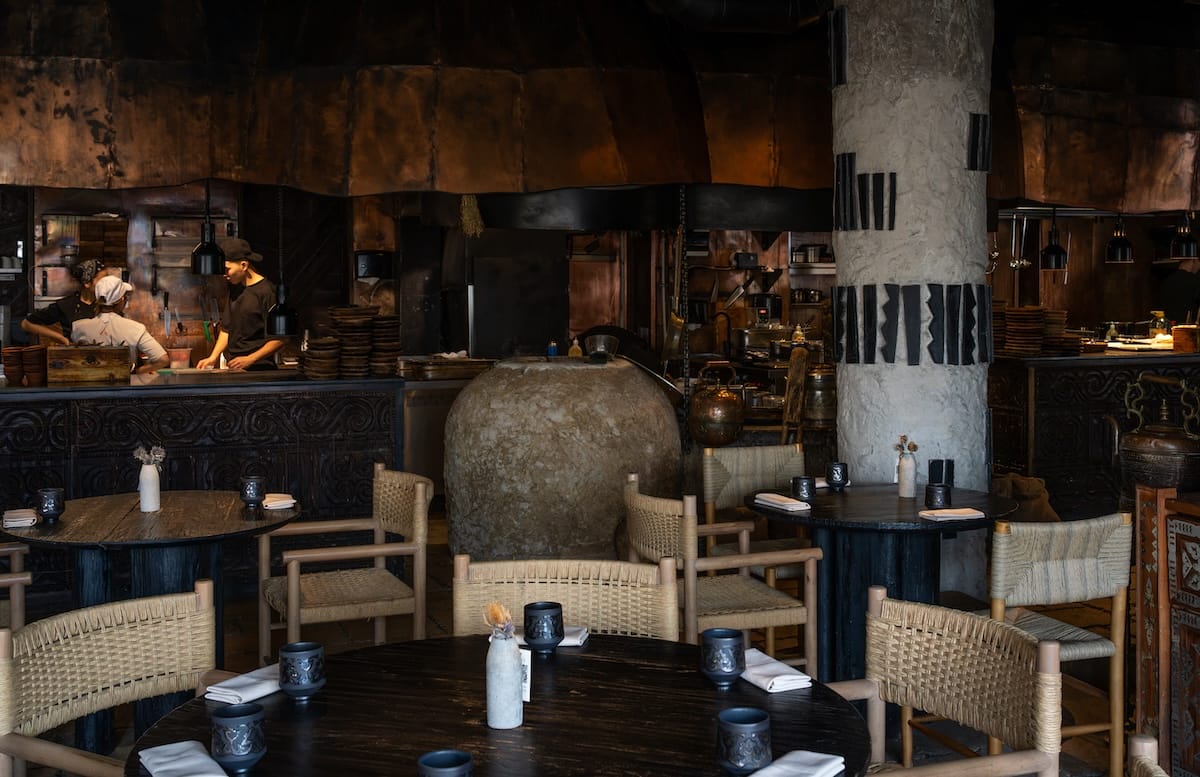 a photo of the inside of a dark, aesthetic restaurant best restaurants in almaty, kazakhstan