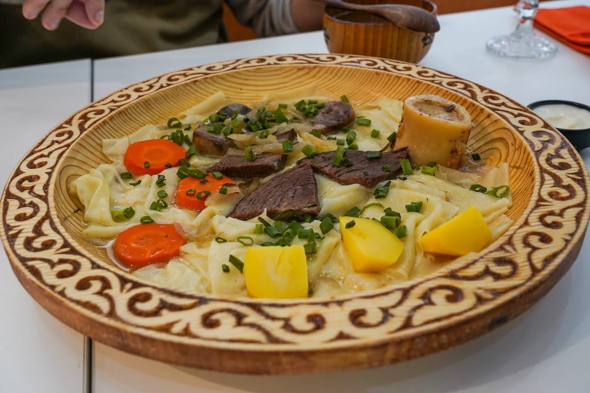 a plate of beshbarmak in a restaurant (national dish of kazakhstan)
