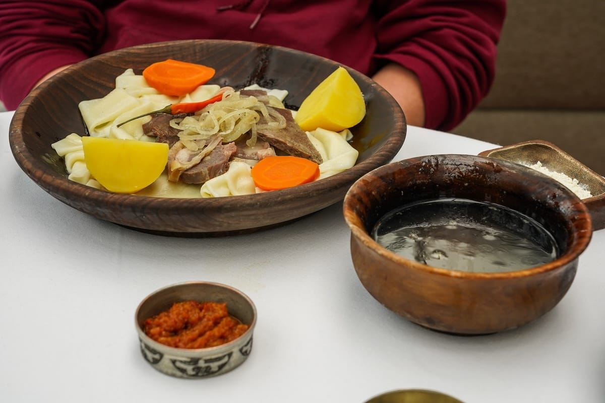 a plate of beshbarmak in a restaurant (national dish of kazakhstan)