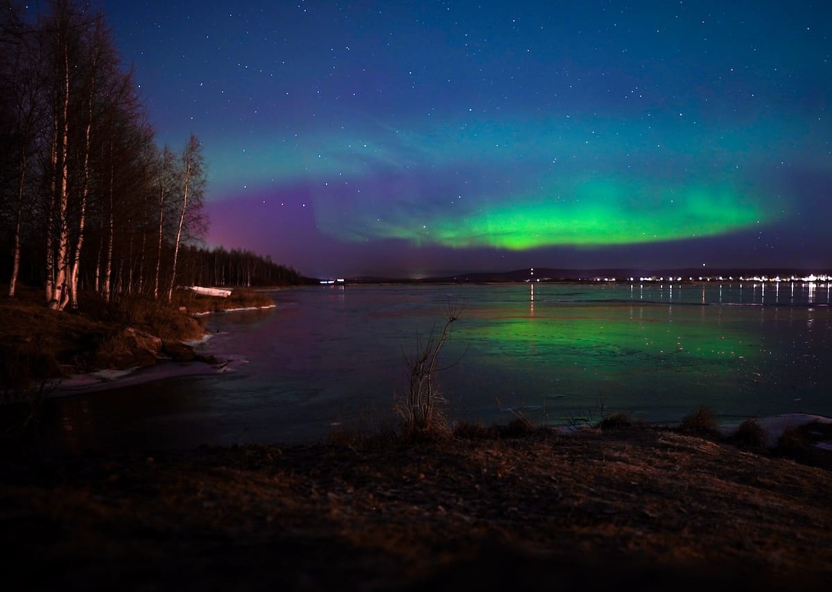 The northern lights from Arktikum many years back.

a photo of the northern lights across a river in rovaniemi in fall