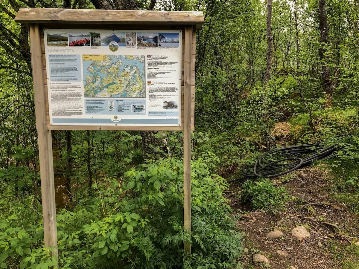 This is a sign welcoming visitors to Sjunkhatten National Park