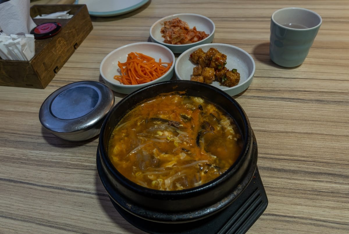 a few banchan along with a bowl of soup at a korean restaurant in kazakhstan
best restaurants in almaty, kazakhstan