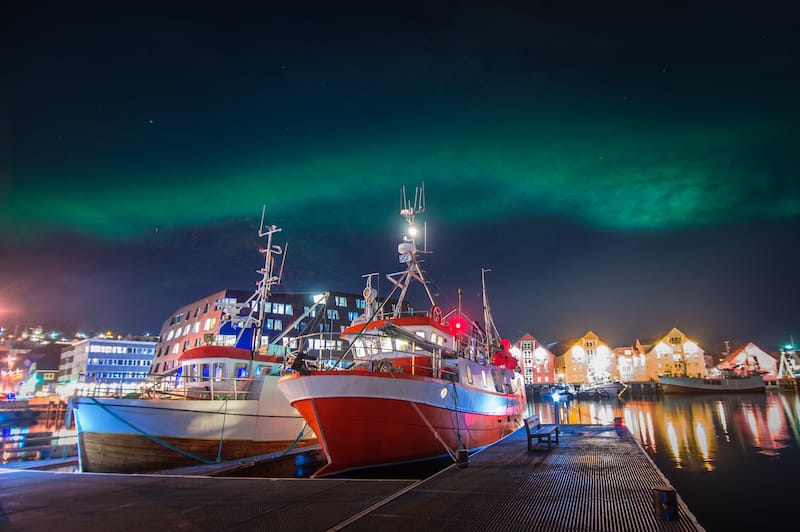 Northern lights over Tromso harbor
