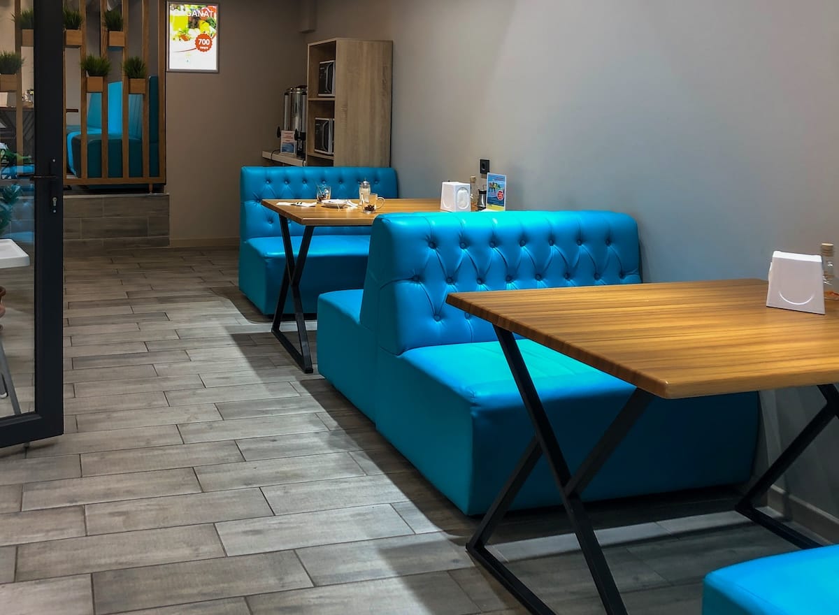 inside a casual restaurant with blue booths
best restaurants in almaty, kazakhstan