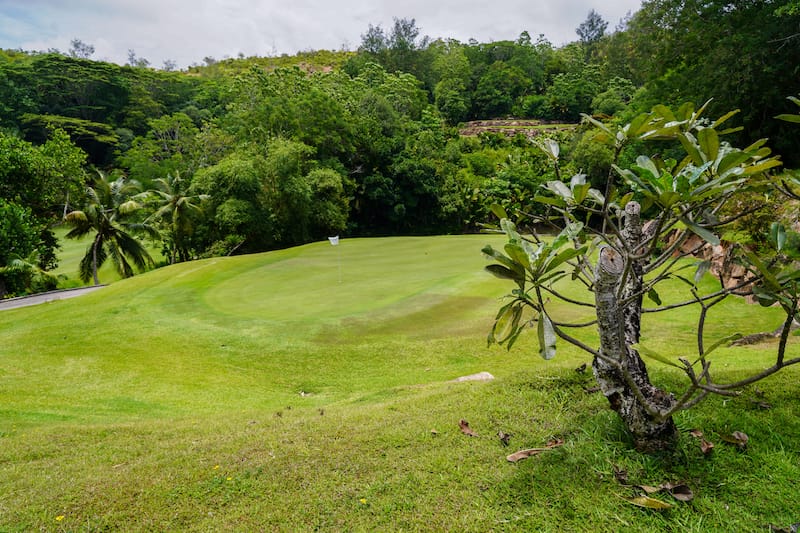 Walking through a golf course to get to a public beach