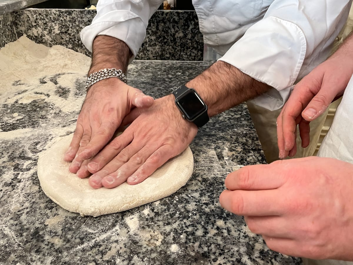 Learning to create the pizza!