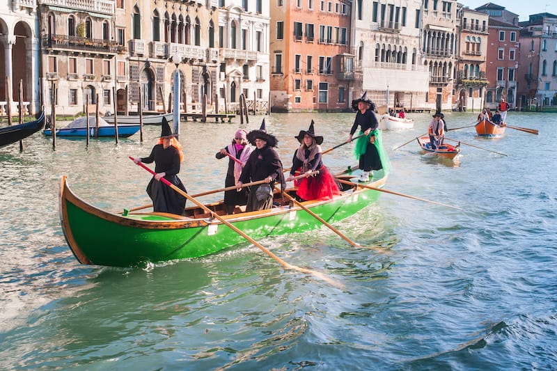 Witches Rowing at Regatta of Befana in Venice - Dietmar Rauscher - Shutterstock
