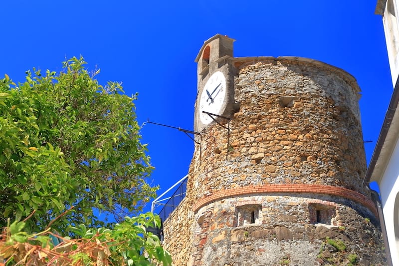 Clock tower on Riomaggiore Castle - Inu - Shutterstock