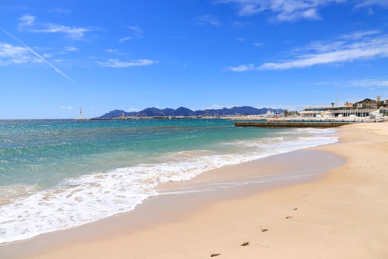 Taking a walk along a beach in Cannes