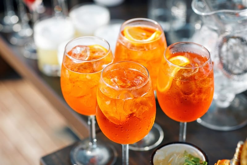 You'll get to enjoy a spritz (or three!) as you cook