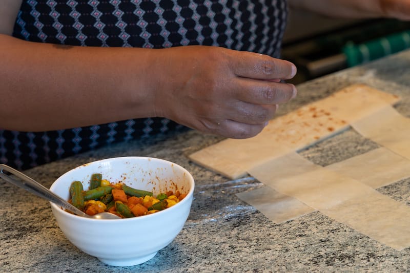 Learning how to make samosas at the cooking class