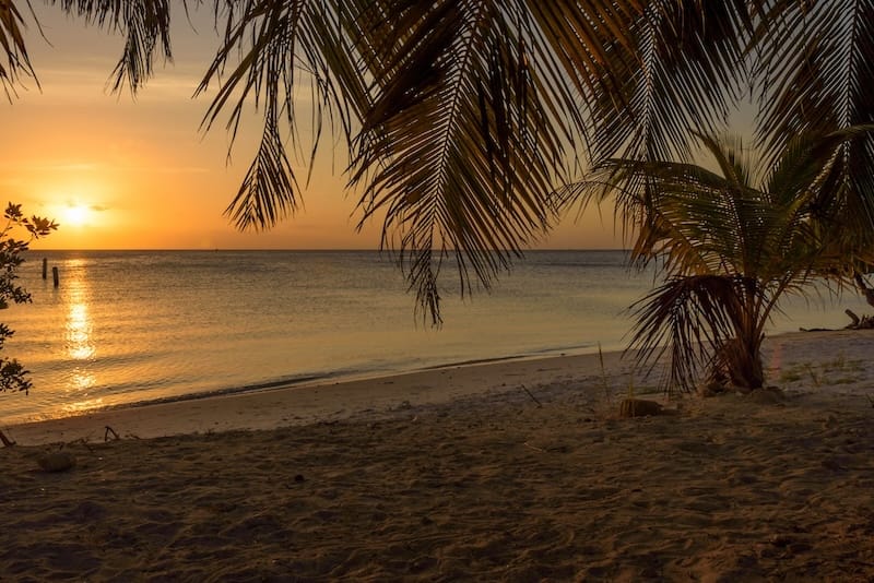 a sunset over a beach in Aruba (Surfside Beach)