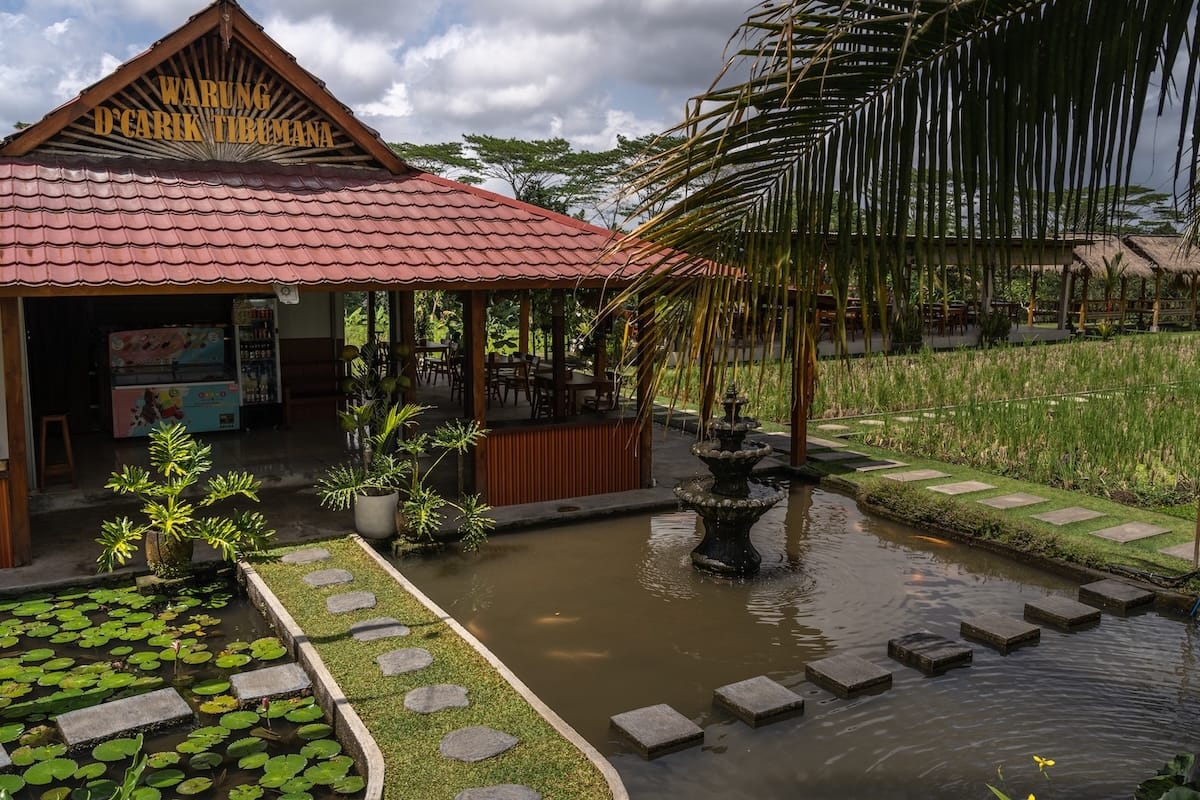 This is a photo of a warung before the Tibumana Waterfall - it is in a rice paddy area