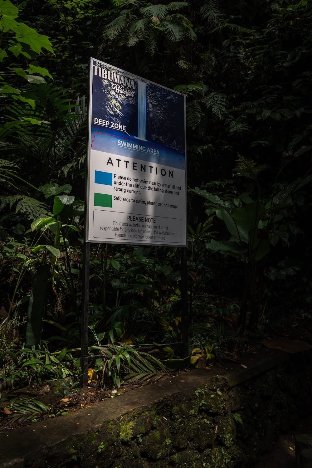 This is a sign at the Tibumana Waterfall indicating what is off-limits in the swimming zone area