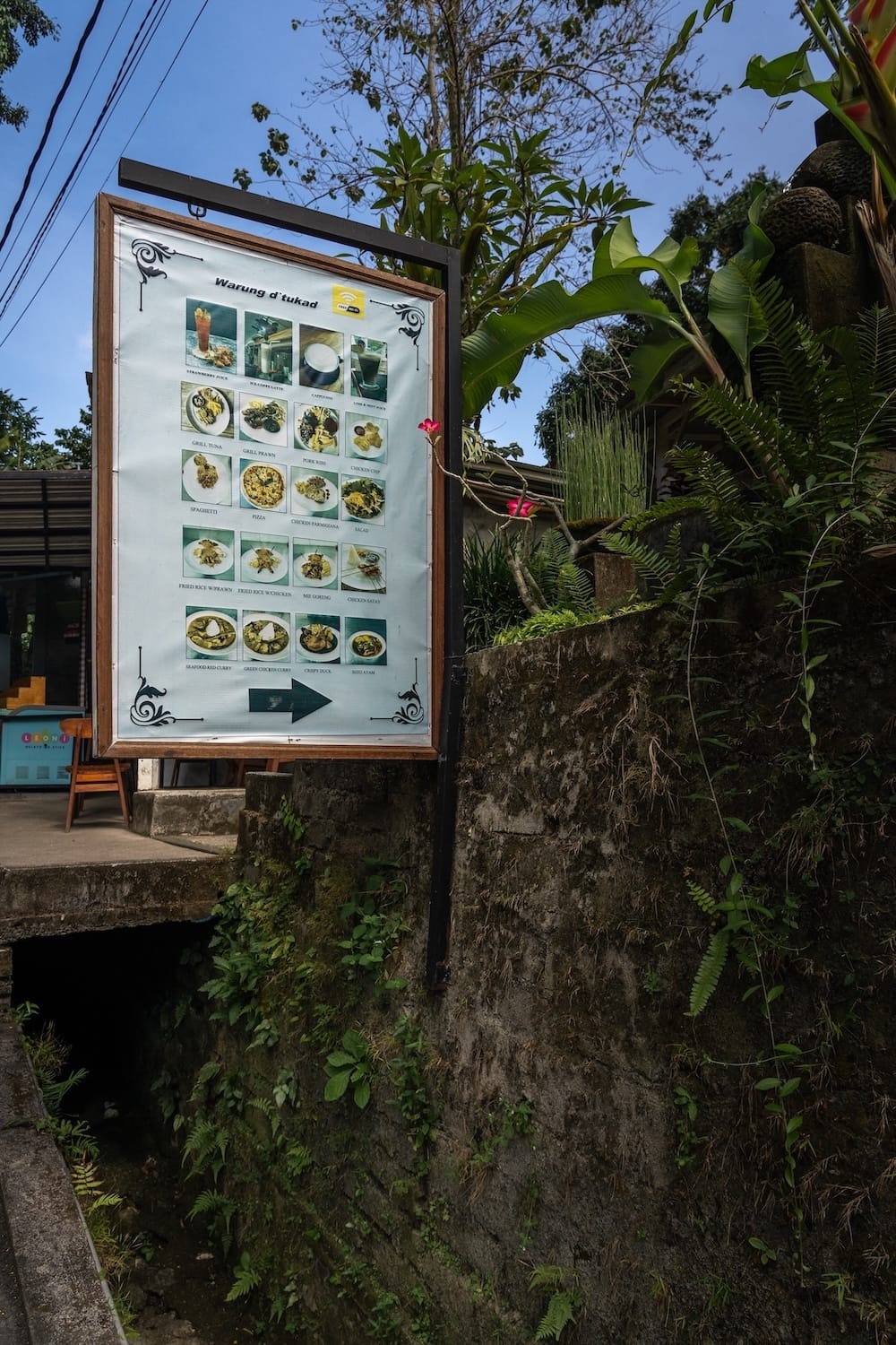 A sign of a warung in Bali at Kanto Lampo with the food options they have