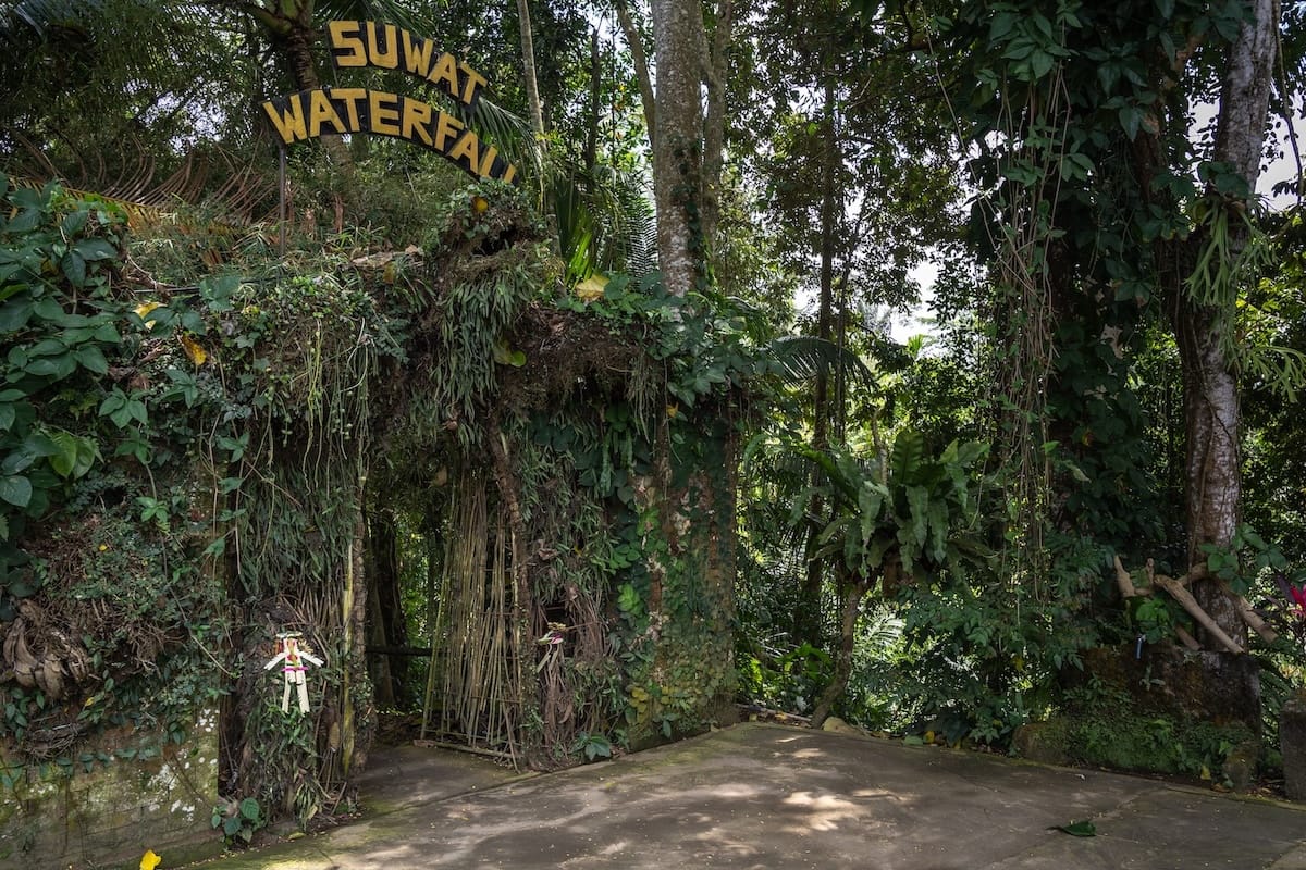 This is the entry to Suwat Waterfall's path - it has a large sign and bamboo tunnel