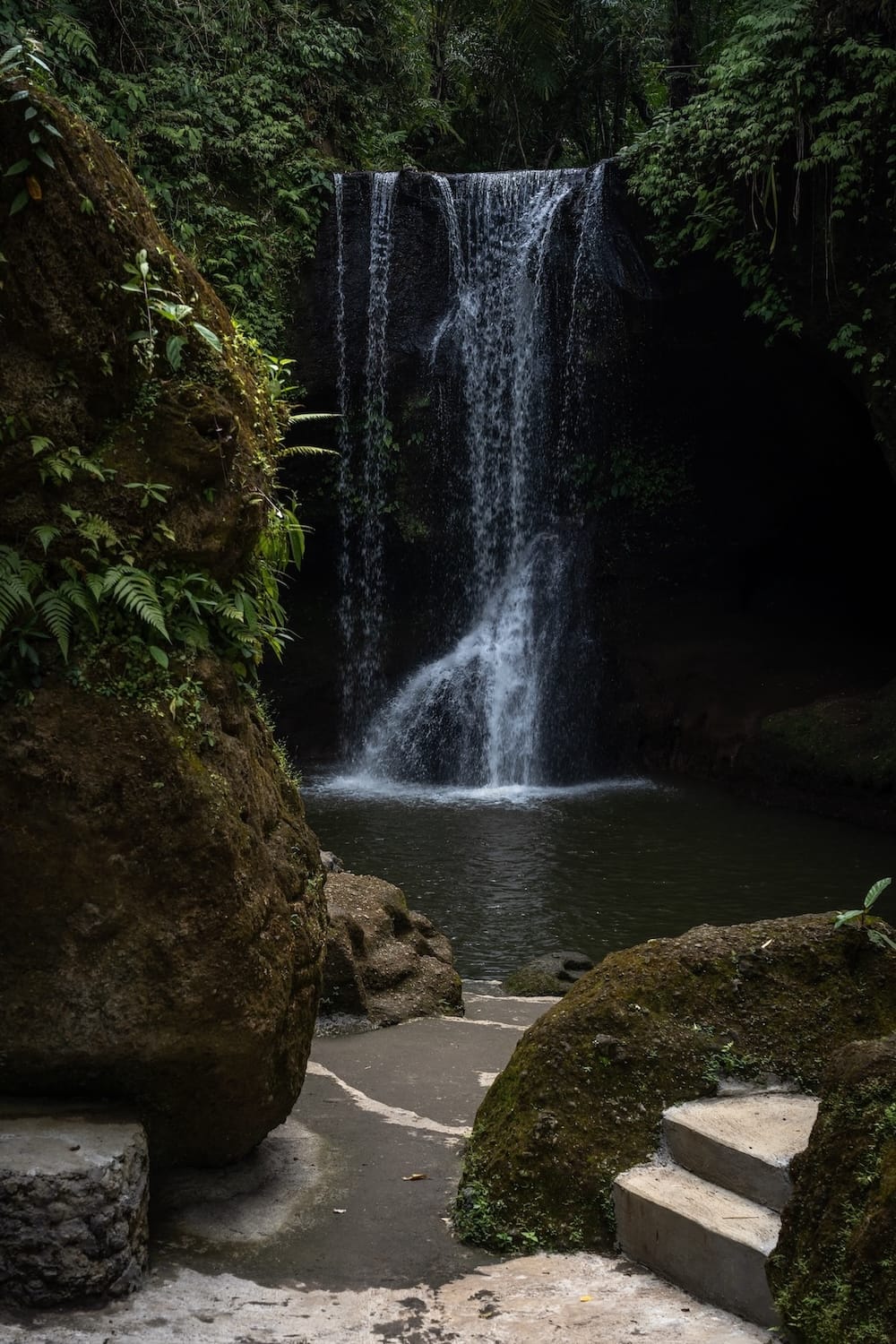 This is Suwat Waterfall and its very weak flow in dry season - there are rocks I am shooting the camera from behind so it is a distance shot