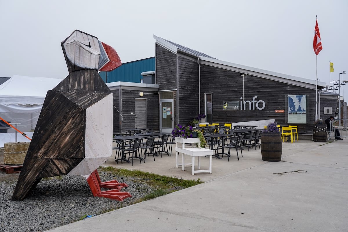 Vardø Tourism Information Center - a building wth a wooden puffin in front of it.