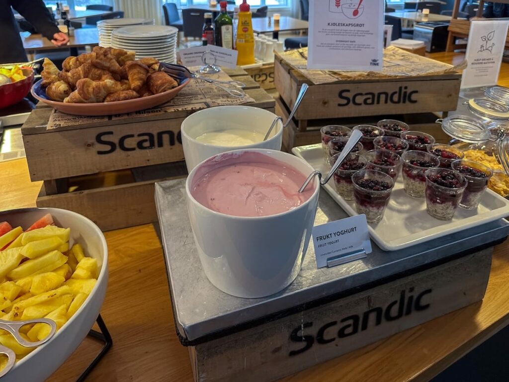 Yogurt, granola, and fruit on the breakfast buffet at Scandic Bryggen in Honningsvåg, Norway.