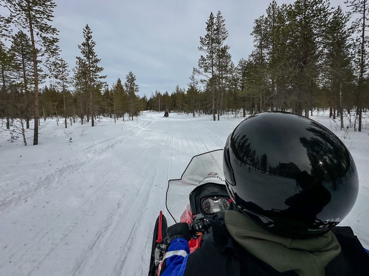 This is a man snowmobiling through a birch forest in Rovaniemi, Finland
Snowmobiling in Rovaniemi-11