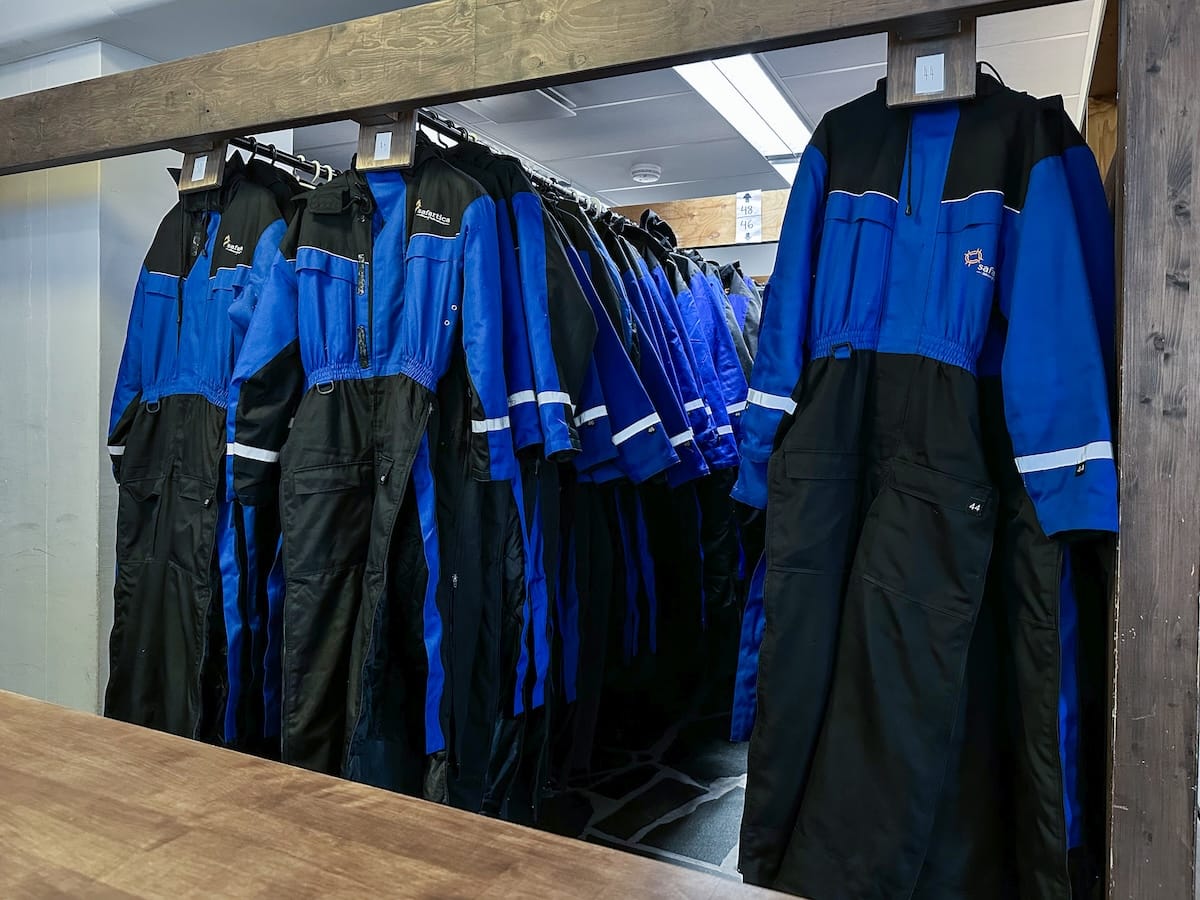Snowmobiling in Rovaniemi, Finland: Best tours, tips, and what to expect.
Photo: these are the snowmobile/winter suits you will get before your tour to help keep you warm. The photos is a picture of them hanging at the Safartica office.