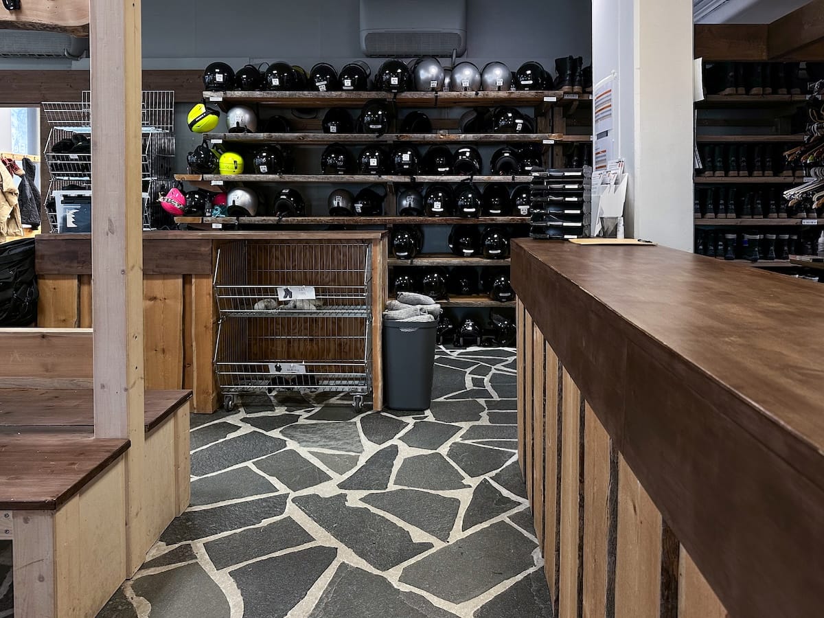 Photo: a large changing room at Safartica with a wall of helmets