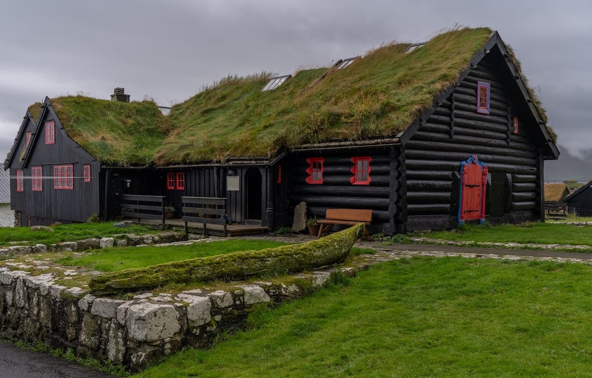 Kirkjubøargarður in the Faroe Islands (a black house with red doors and shutters that is an old farm)