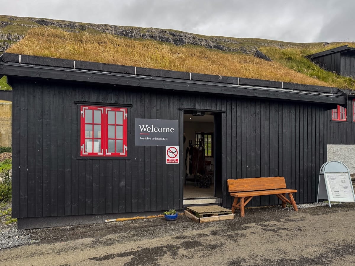 The visitor center in Kirkjubøur (purchase tickets here)

A black building with red shutters with a grass roof in the faroe islands