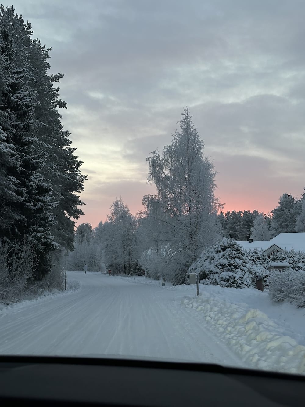 a car driving in fresh snow in lapland in november