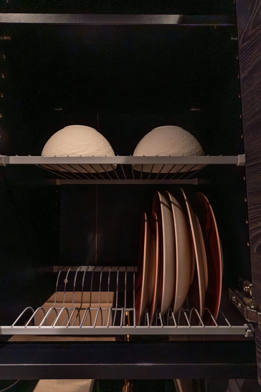 plates and bowls on a drying rack