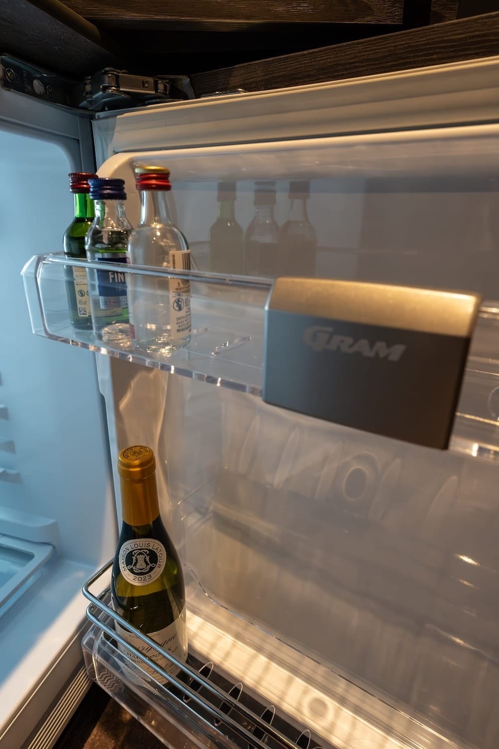 The insides of a mini-fridge at Levi OloResort (champagne and small liquor bottles)
