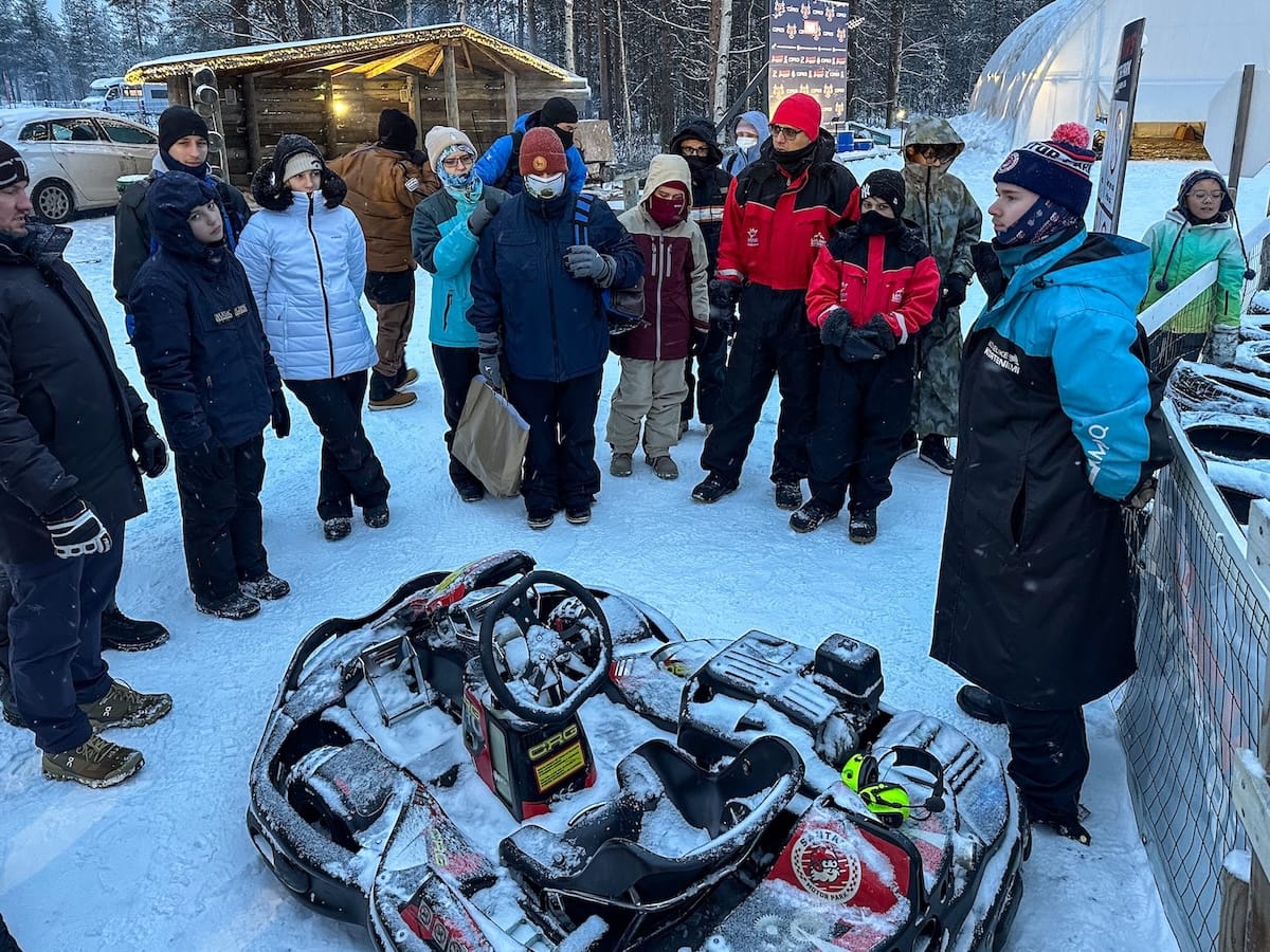 Ice karting in Rovaniemi | Santa's Motor Park
A group of tourists standing around an ice kart getting briefed before the experience.
